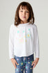 Front view of a girl wearing the Chaser Under The Stars Girls Tee on a neutral background with star pants