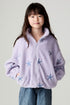 Front view of a girl wearing the Chaser Varsity Stars Girls Varsity Jacket on a neutral background looking at camera