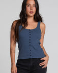 Front view of a woman wearing the Chaser Velora Dark Denim Tank on a neutral background 