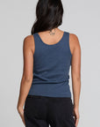 Back view of a woman wearing the Chaser Velora Dark Denim Tank on a neutral background with hands at sides