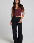 A full body front view of a woman wearing the Chaser Verze Brick Tank on a neutral background
