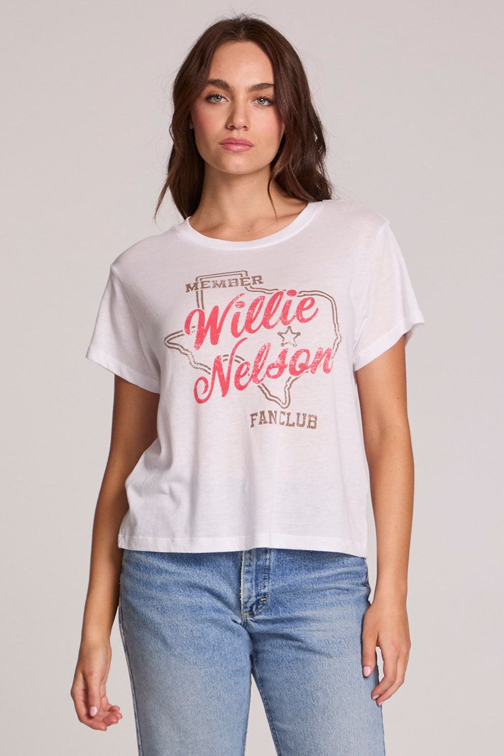 Front view of a woman wearing the Chaser Willie Nelson Fan Club Tee on a neutral background with arms at sides