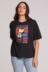 Front view of a woman wearing the Chaser  Woodstock Bird on Guitar Tee on a neutral background with bluejeans