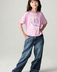 A full body front view of a girl wearing the Chaser Yee Haw Girls Tee on a neutral background