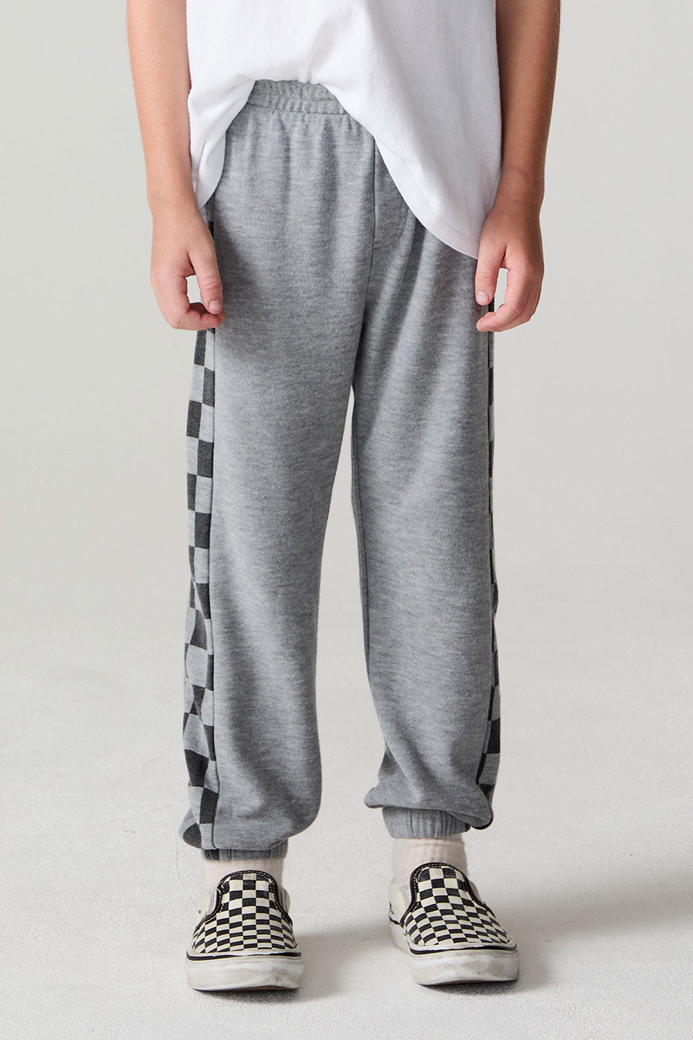 Front view of a boy wearing the Chaser Color Block Heather Grey Barrel Leg Pants on a neutral background