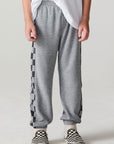 Front view of a boy wearing the Chaser Color Block Heather Grey Barrel Leg Pants on a neutral background
