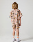 Full body back view of a boy wearing the Chaser Construction Days Tee on a neutral background