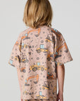 Back view of a boy wearing the Chaser Construction Days Tee on a neutral background