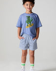 A full body front view of a boy wearing the Chaser  Cozy Beach Short on a neutral background