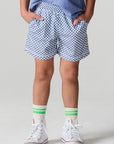 Front view of a boy wearing the Chaser  Cozy Beach Short on a neutral background