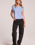 Full body front view of a woman wearing the Chaser Cropped Cap Sleeve Blue Hydrangea Crewneck Tee and sneakers on a neutral background
