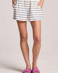 Front view of a woman wearing the Chaser French Riviera Stripe Harper Shorts and pink shoes