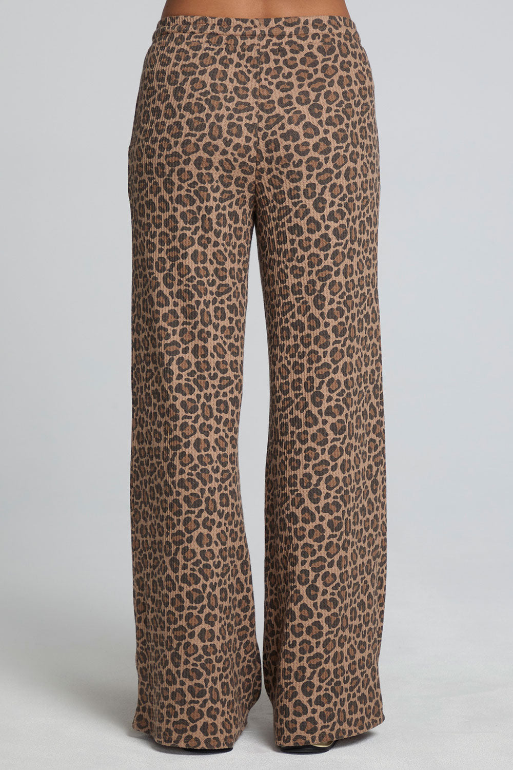 Back view of a woman wearing the Chaser  Jorgia Leopard Pant on a neutral background
