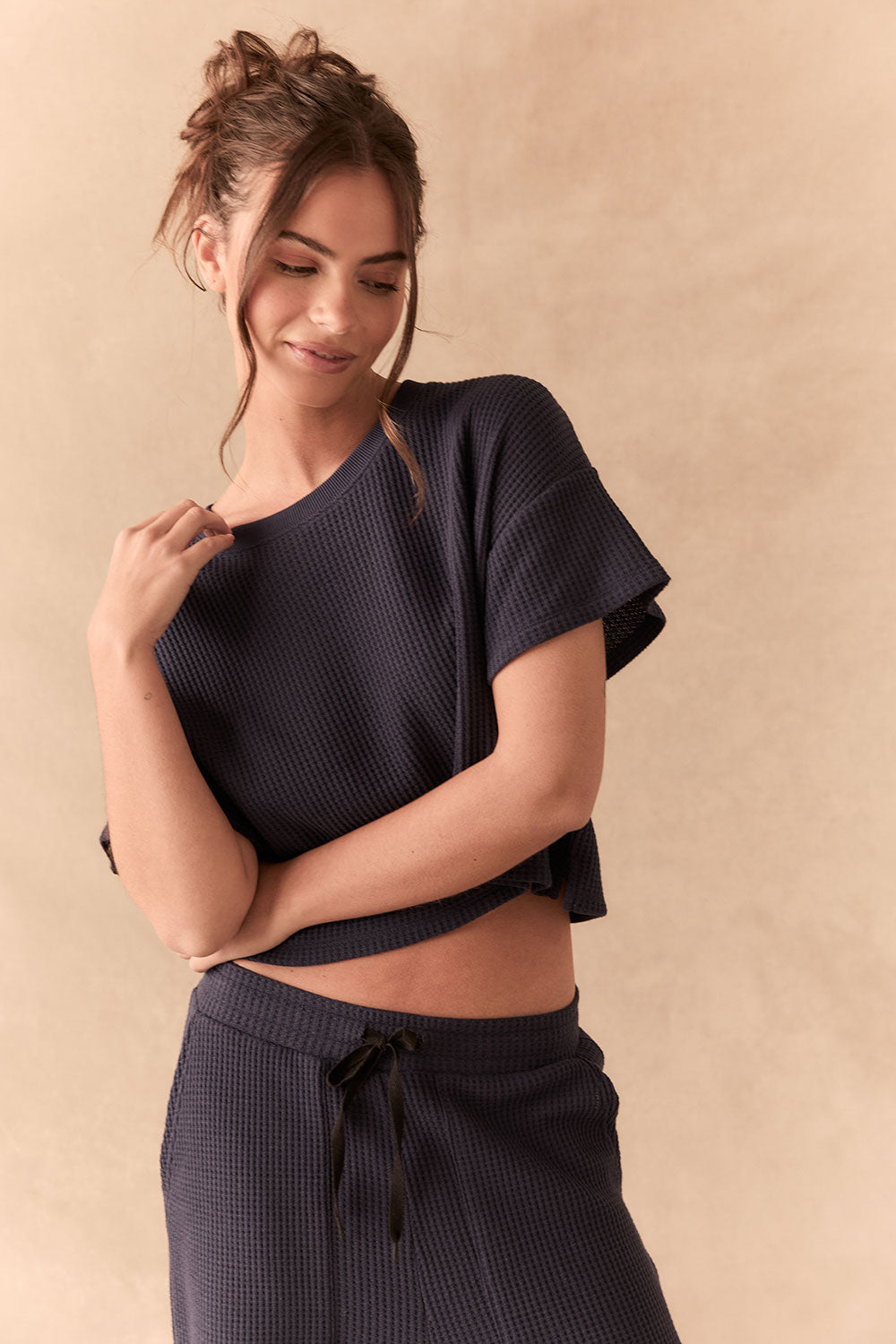 Front view of model in Irvine Tee in midnight blue with soft thermal texture and matching Billy Joggers against a beige background