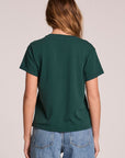 Back view of a woman wearing the Chaser Le Sports Club Tee on a neutral background