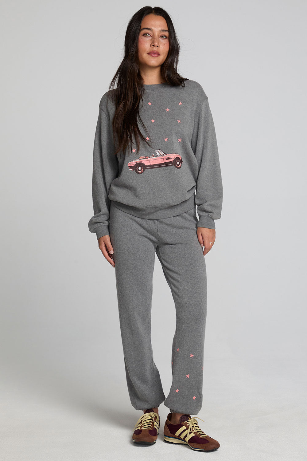 A full body front view of a woman wearing the Chaser Mini Star Glaze Pants on a neutral background