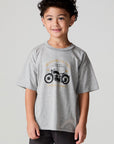 Front view of a boy wearing the Chaser  Moto LA Tee on a neutral background