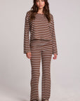 A full body front view of a woman wearing the Chaser Noorh Nutty Brown Stripe Pants on a neutral background 