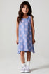 A full body front view of a girl wearing the Chaser Seashell Dreams Allover Dress on a neutral background with arms down
