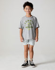 Full body front view of a boy wearing the Chaser Tennis Club Tee on a neutral background