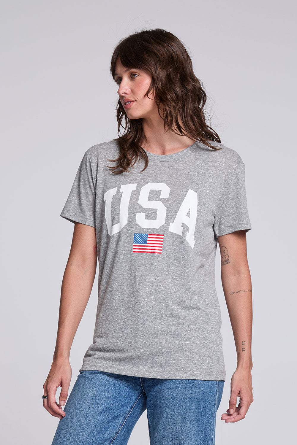 Side angle of Chaser USA Flag Oversized Tee in Streaky Grey featuring bold collegiate USA lettering and soft triblend drape