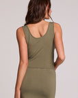 Back view of a woman wearing the Chaser Verze Forager Green on a neutral background with arm on hip