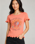 Women’s coral Grateful Dead 1977 Spring Tour graphic tee featuring lettuce-edge ruffle sleeves and hem, shown on model with black denim shorts